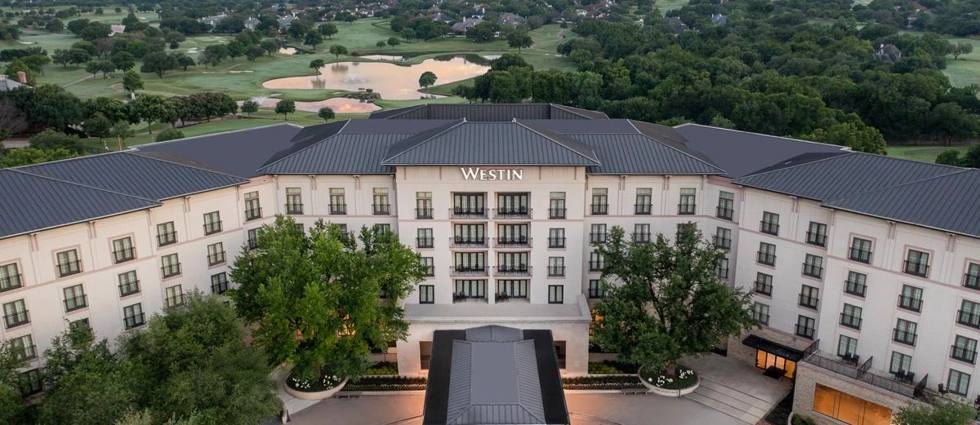 The Westin Dallas Stonebriar Golf Resort and Spa at sunset, beside the golf course